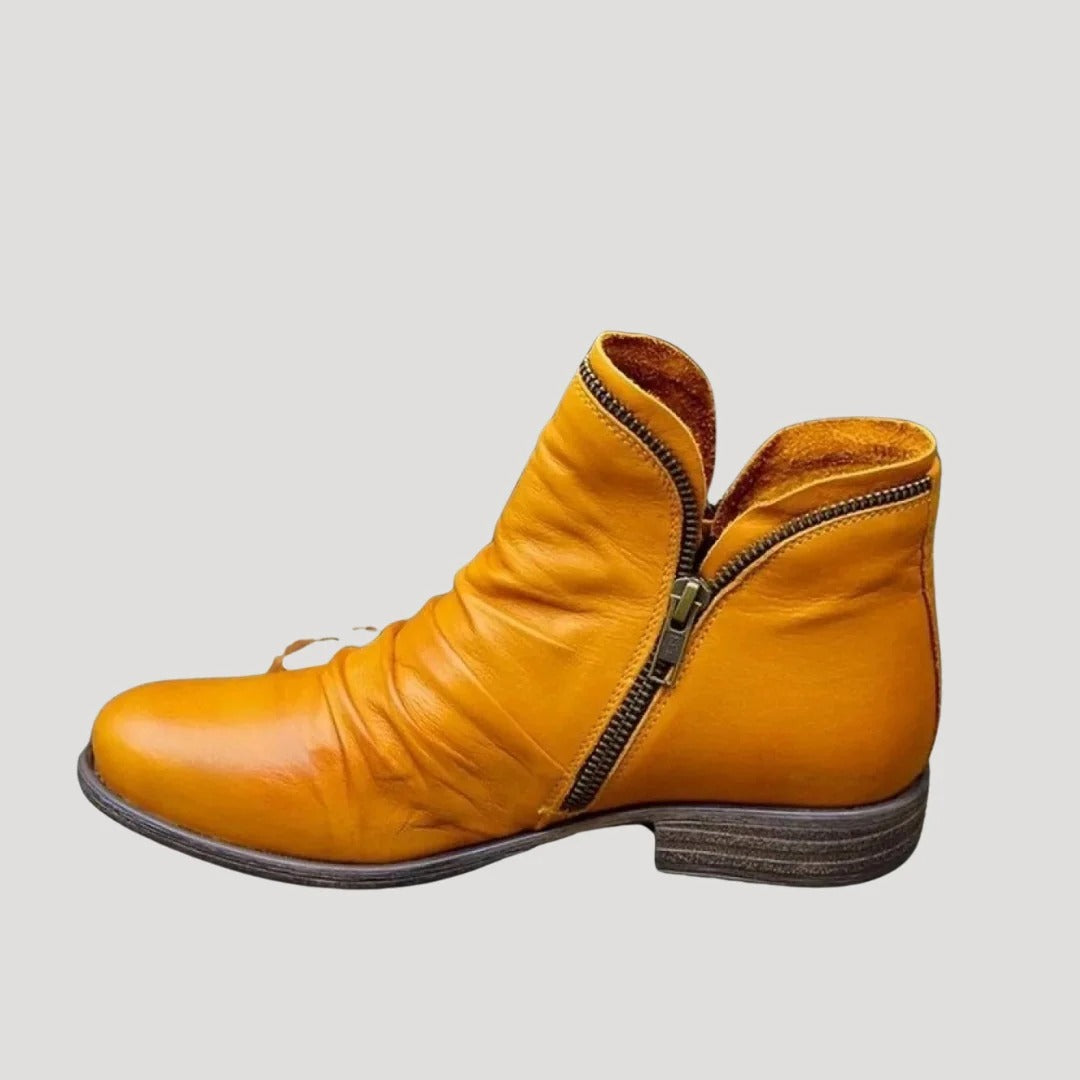 Dam ankelboots i konstläder med dragkedja